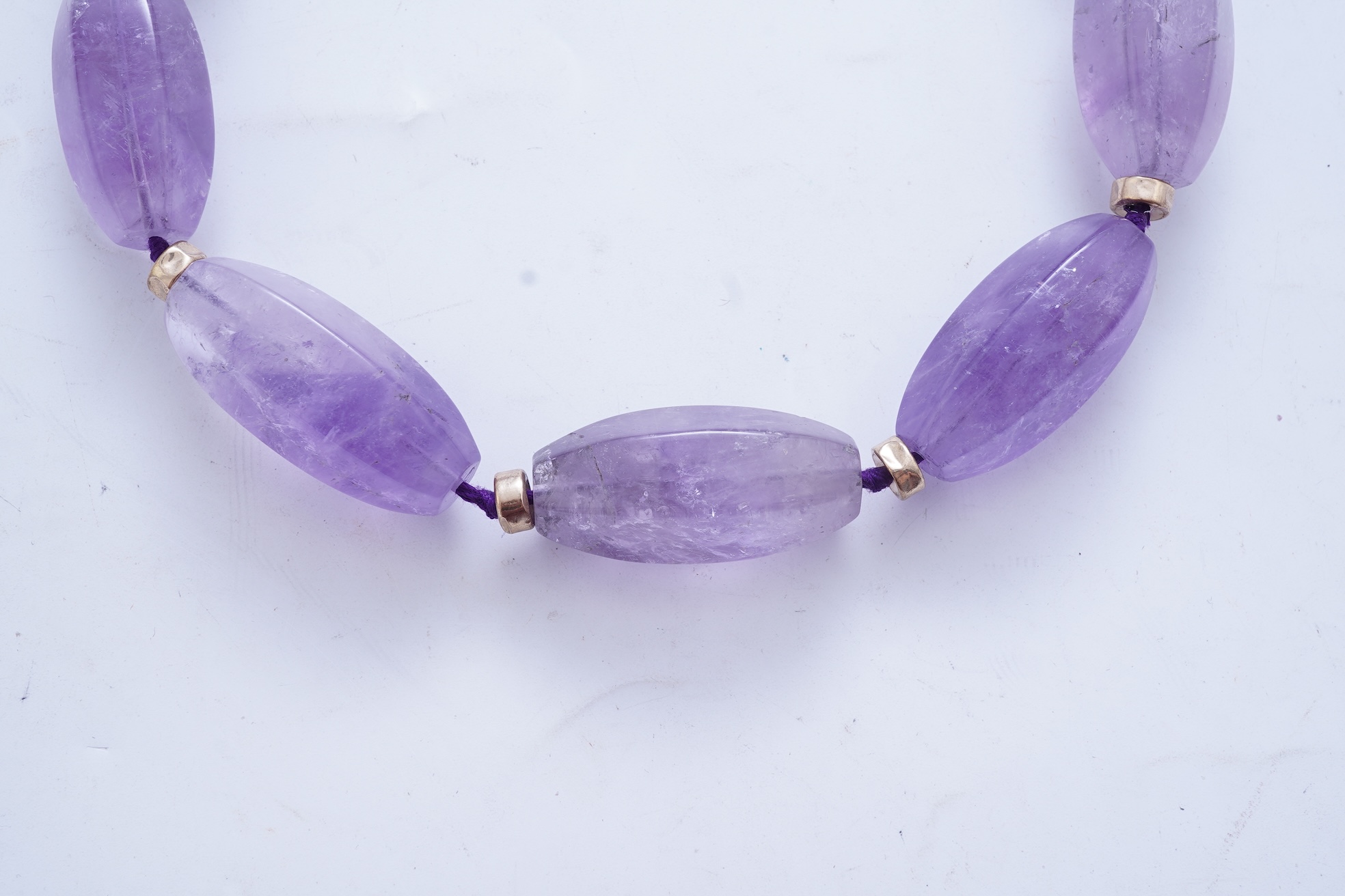 An amethyst and gold necklace